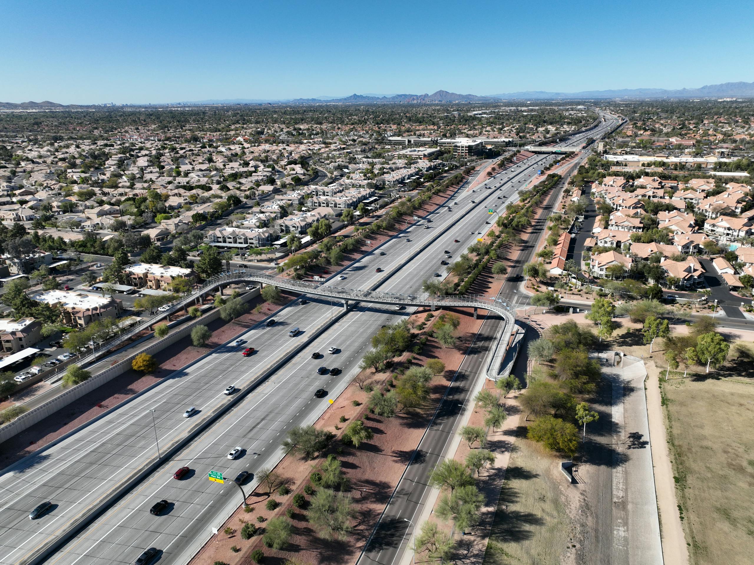 Aerial shot of Chandler, Arizona showcasing highways and residential areas under clear skies.