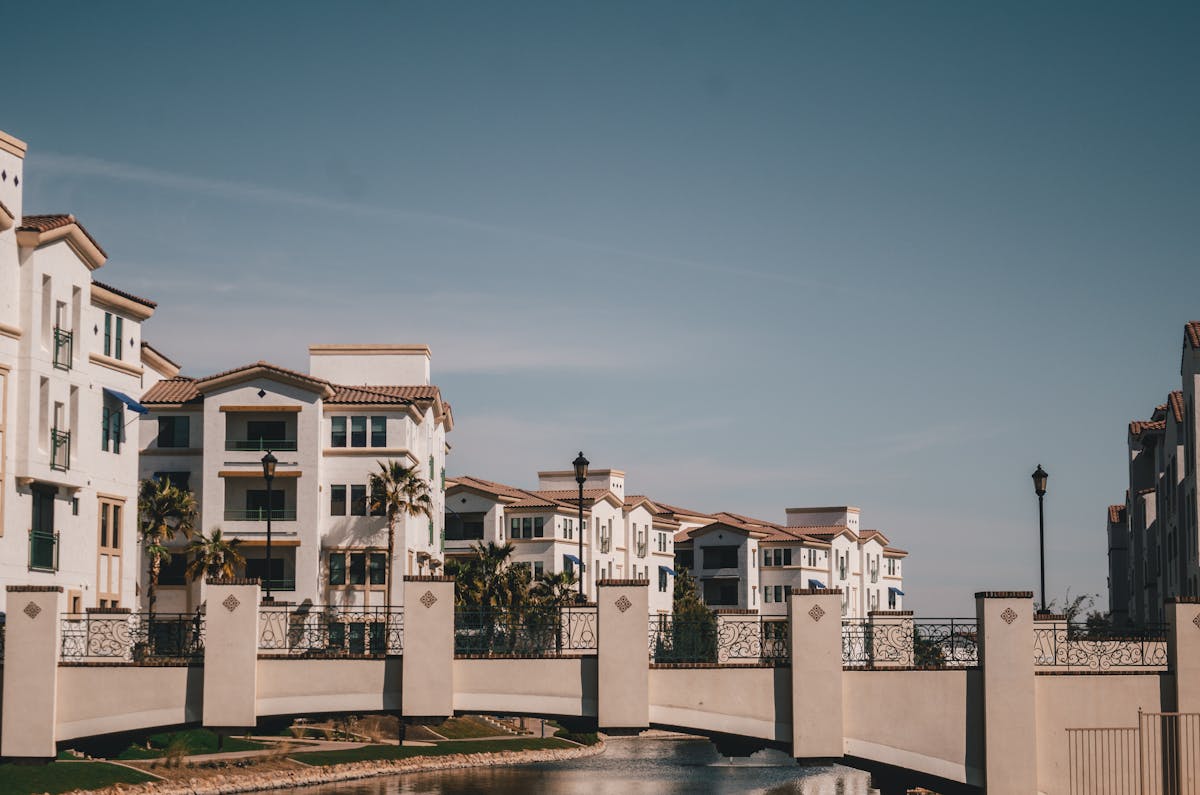 Charming residential district in Chandler, AZ featuring a bridge and canal on a sunny day.